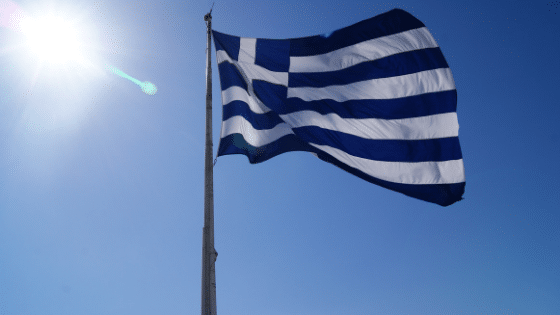 Greek National Flag waving in the air with blue skies